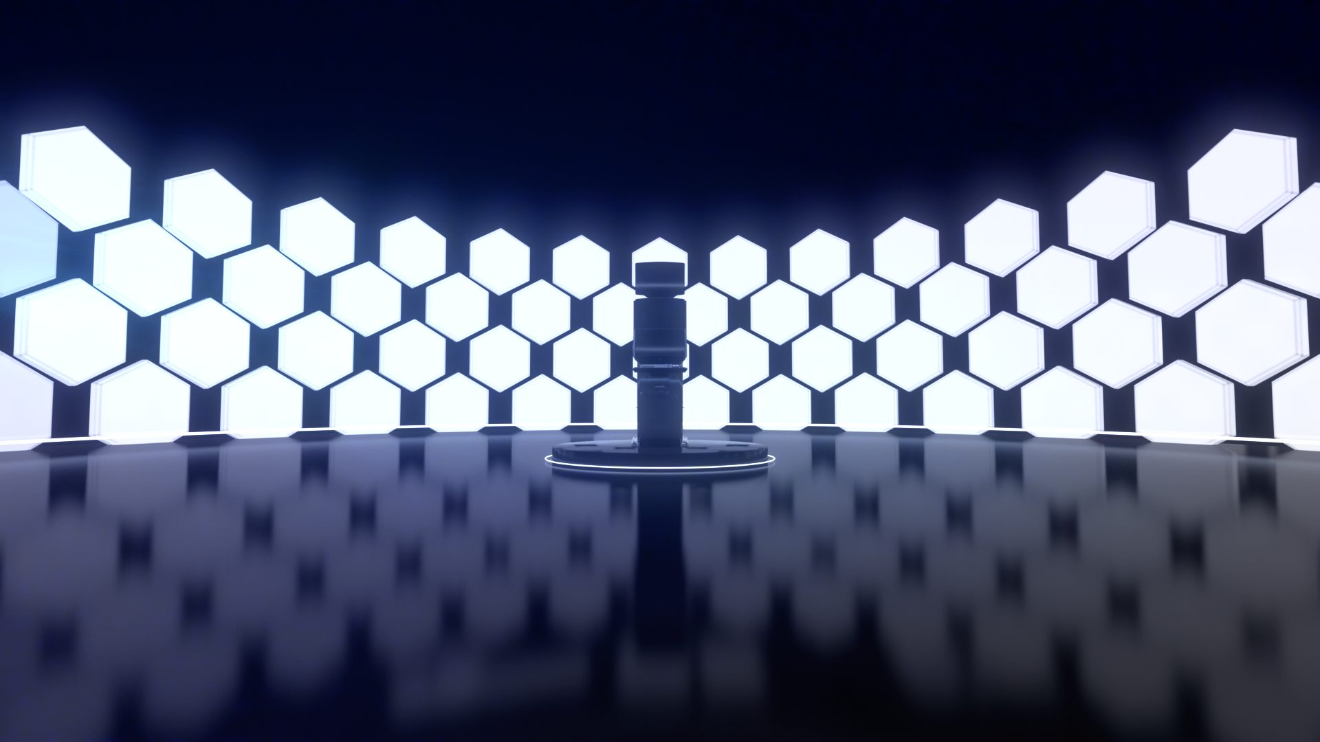 The Kascada terminal on a plinth in a dark studio of glowing hexagons, a frame from the CG launch film
