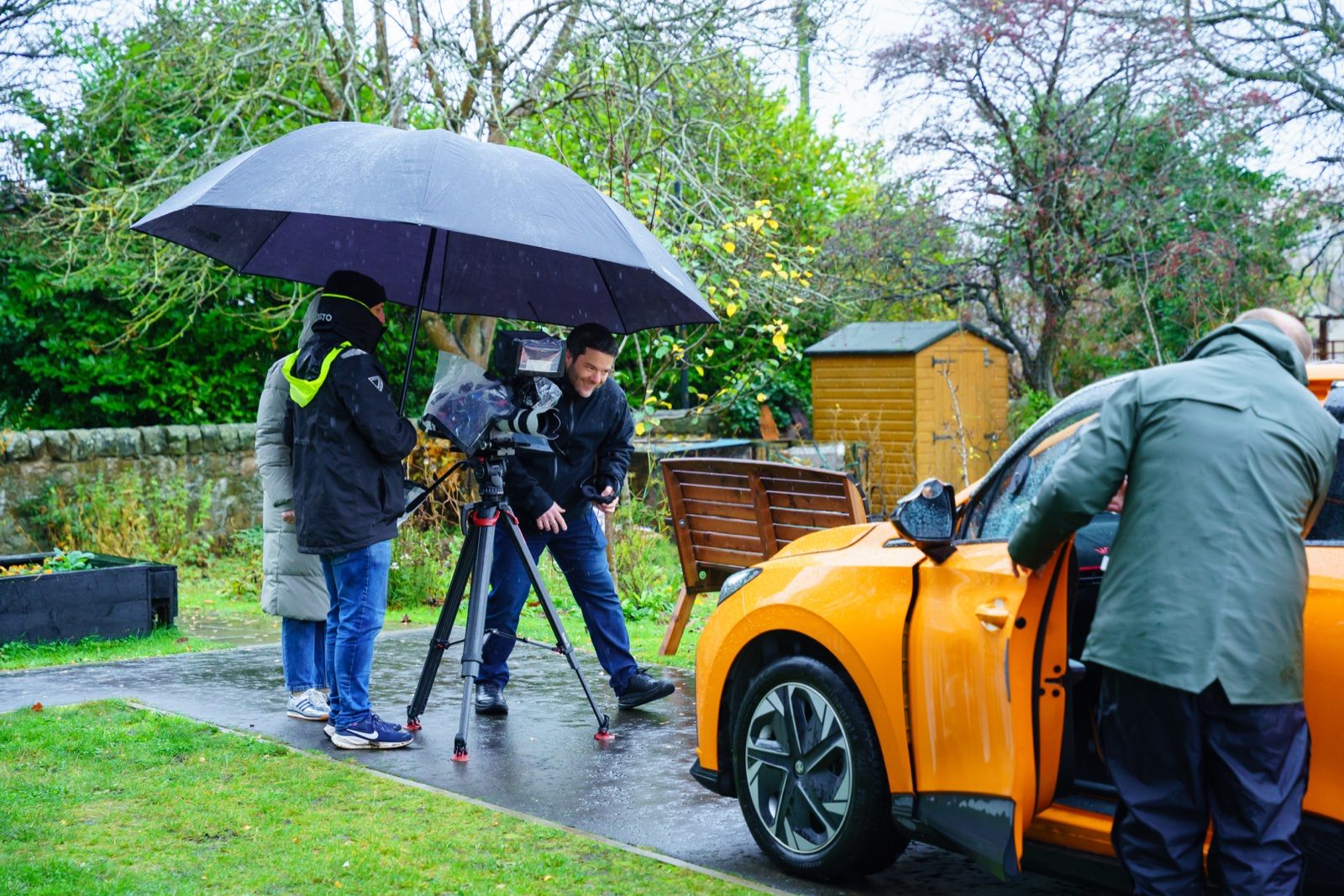 Keeping the camera dry under an umbrella on the rain-soaked Edinburgh shoot